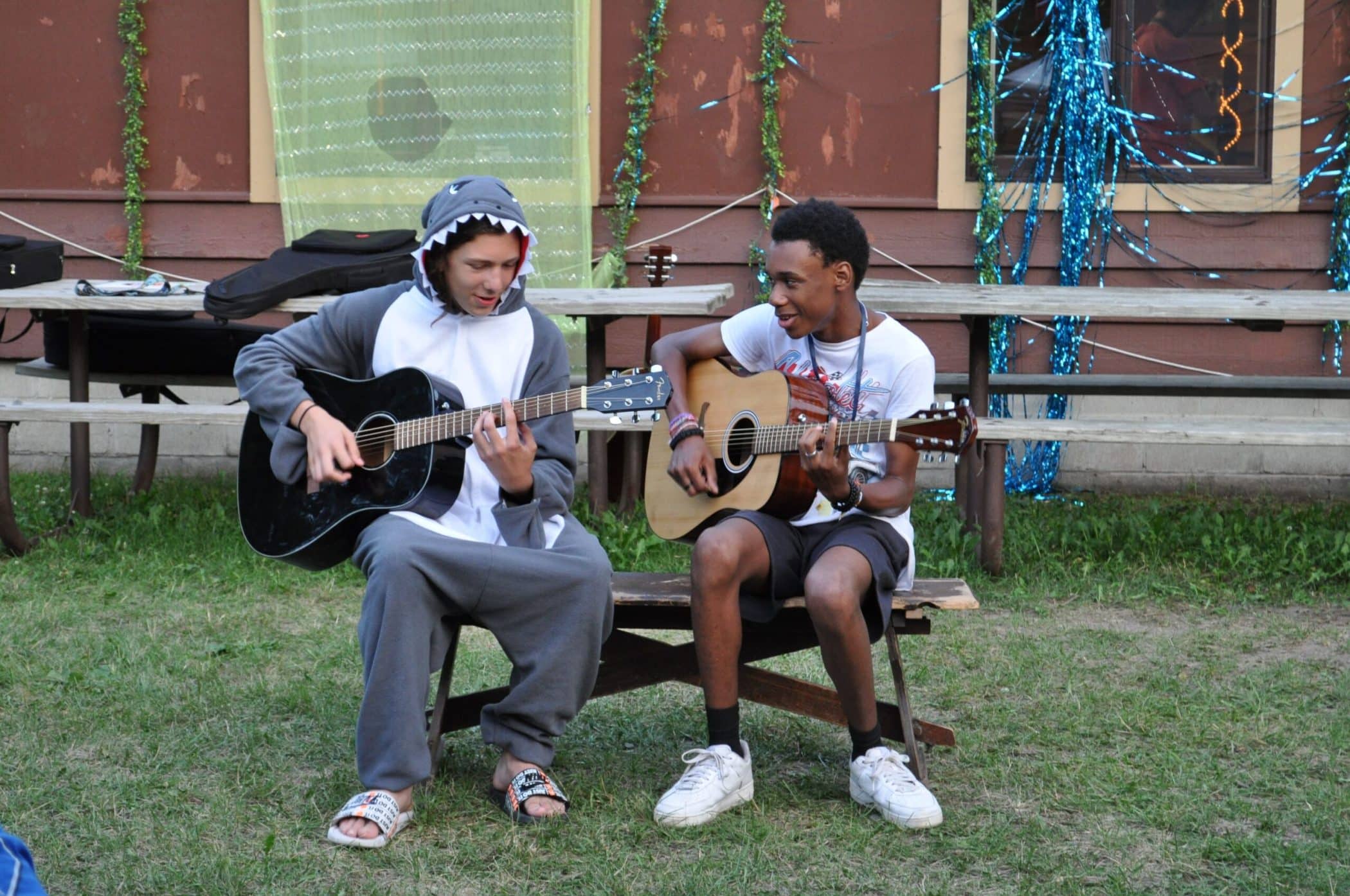 Two campers show of their musical skills at the talent show
